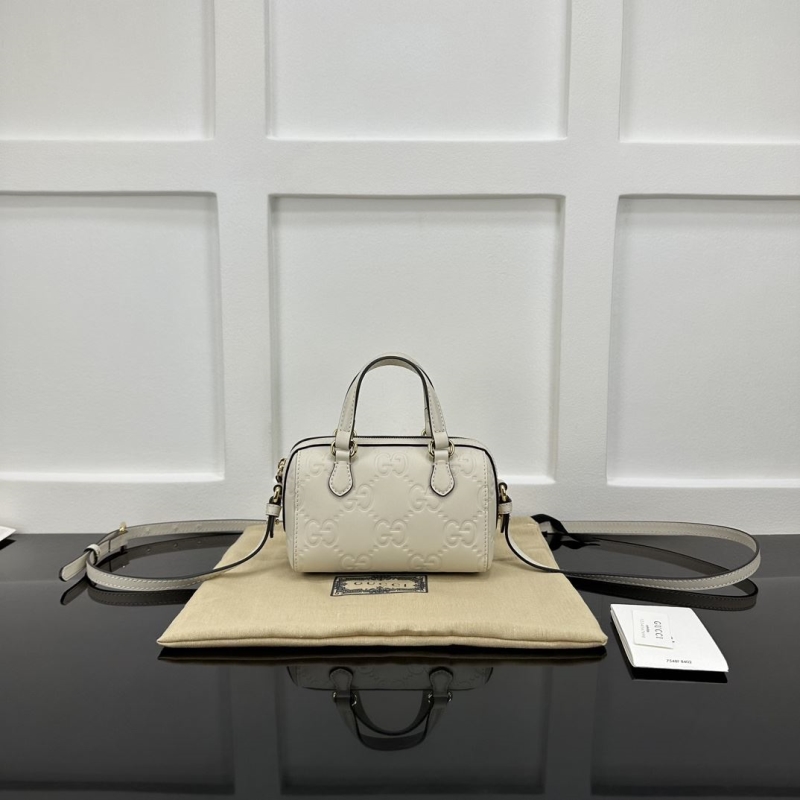 G*u*i top handle bags